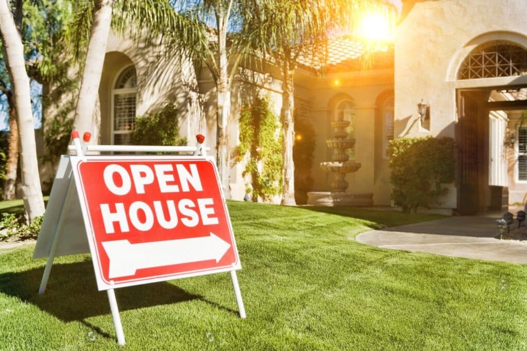 stock photo open house sign in front yard 1908862414 transformed